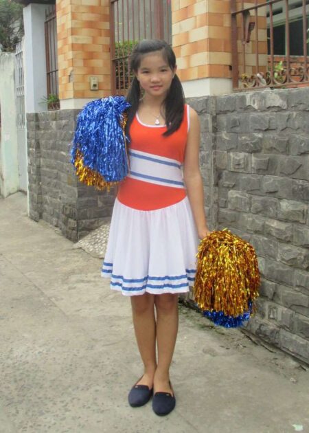 Váy múa cổ động trẻ em cam phối trắng