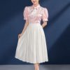 Áo sơ mi nữ hồng phấn kim sa váy xếp ly trắng