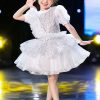 Đầm múa trẻ em kim sa trắng viền bạc
