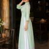 Thuê đồ biểu diễn áo dài lụa xanh pastel phối quần váy trắng