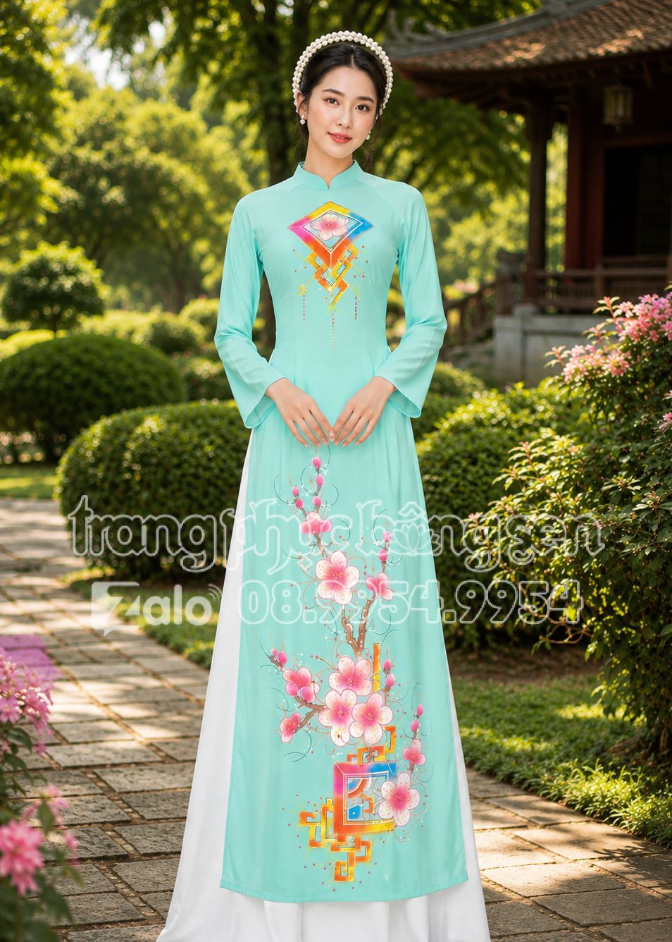 Thuê đồ văn nghệ áo dài lụa xanh ngọc hoa đào