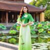 Áo dài cách tân nữ nền xanh họa tiết hoa sen tay cánh voan